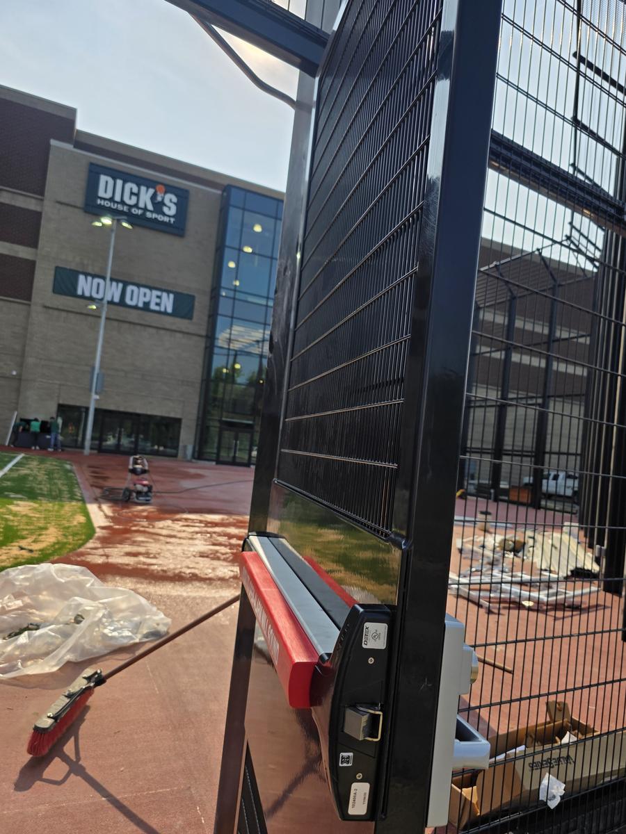 Alarmed panic exit device installed by Lock Raven on a security gate at Dick's House of Sport